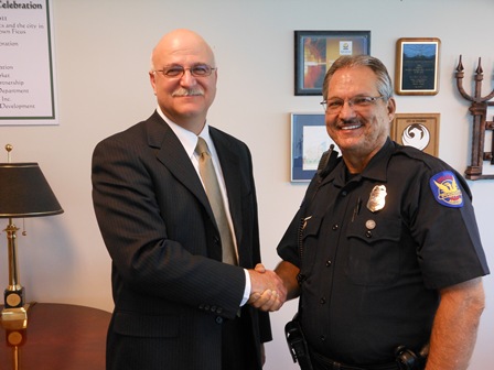 Newly appointed Phoenix Police Chief Danny Garcia  being congratulated by PLEA President Joe Clure.